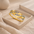 Gilded Curb Link Evil Eye Bangle