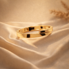 The Infinite Fold Polished Gold Bypass Bangle