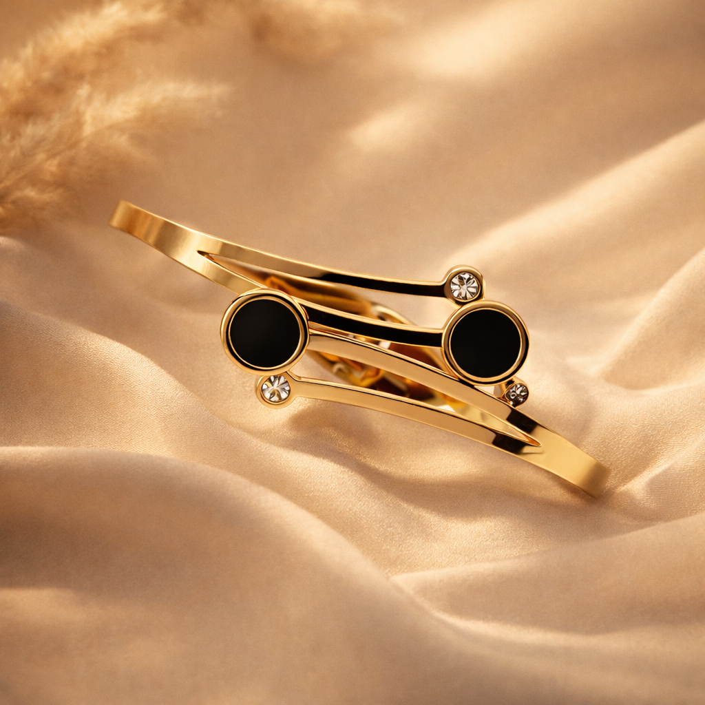 The Onyx Orbit Gold Bypass Bangle