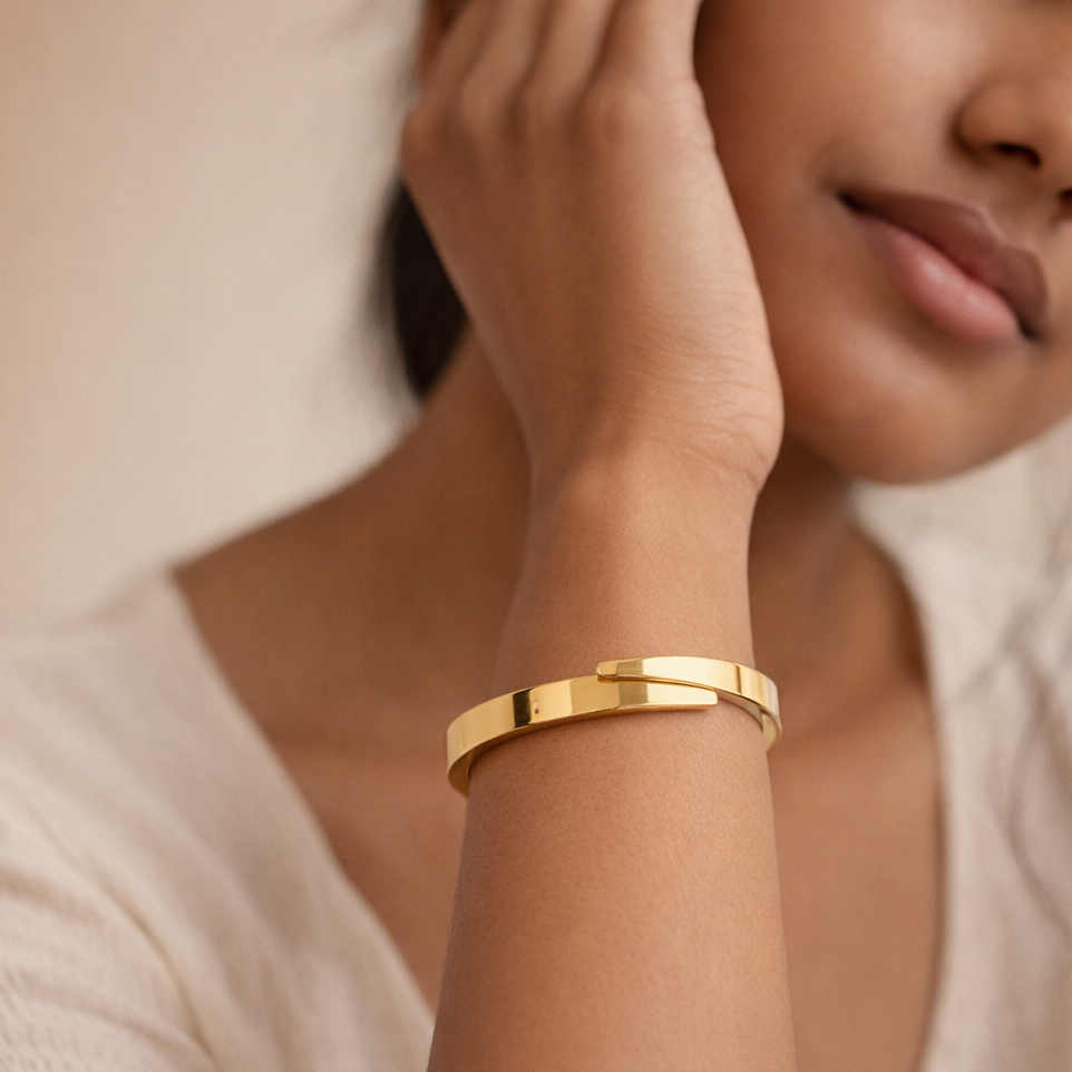 The Infinite Fold Polished Gold Bypass Bangle