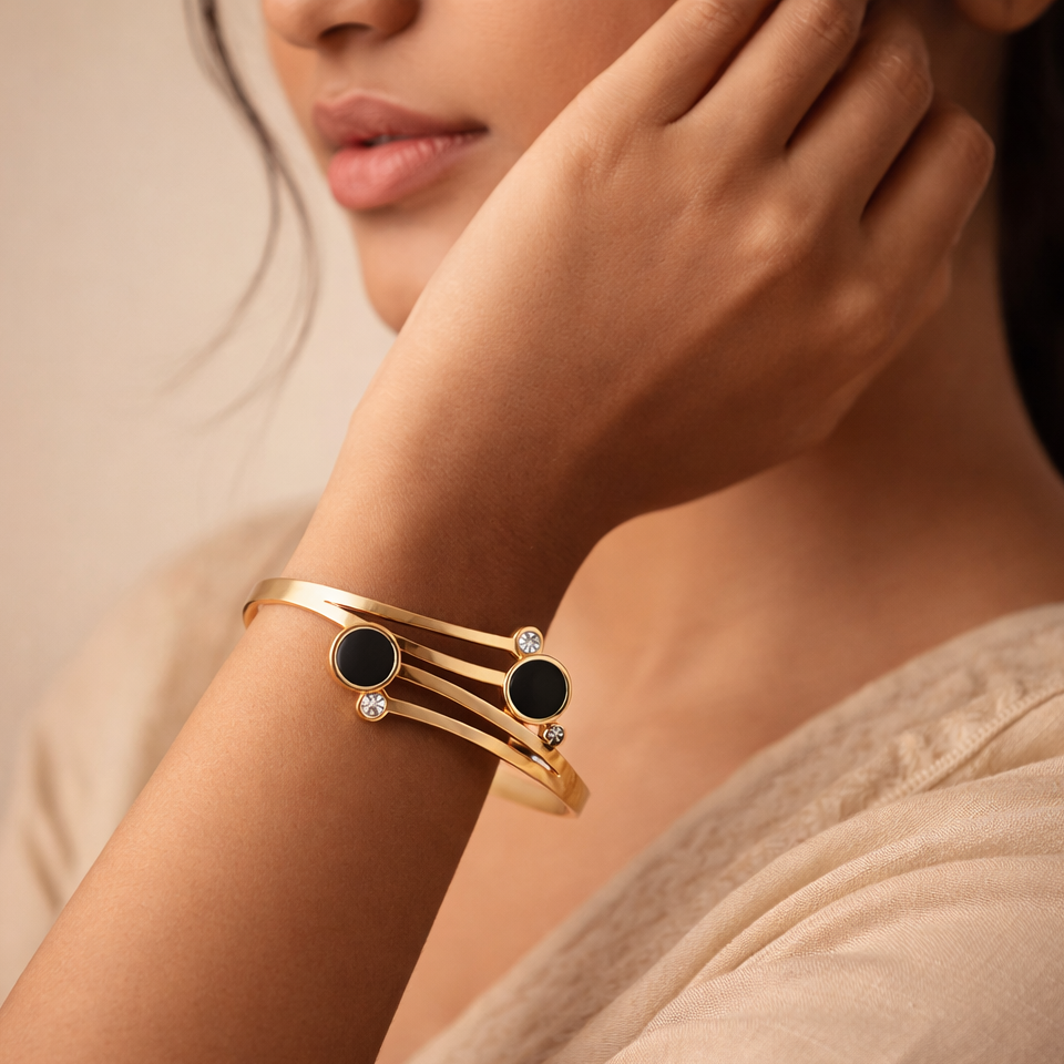 The Onyx Orbit Gold Bypass Bangle