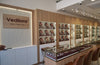 Jewelry store interior with 'Vedilora' branding and display cases.