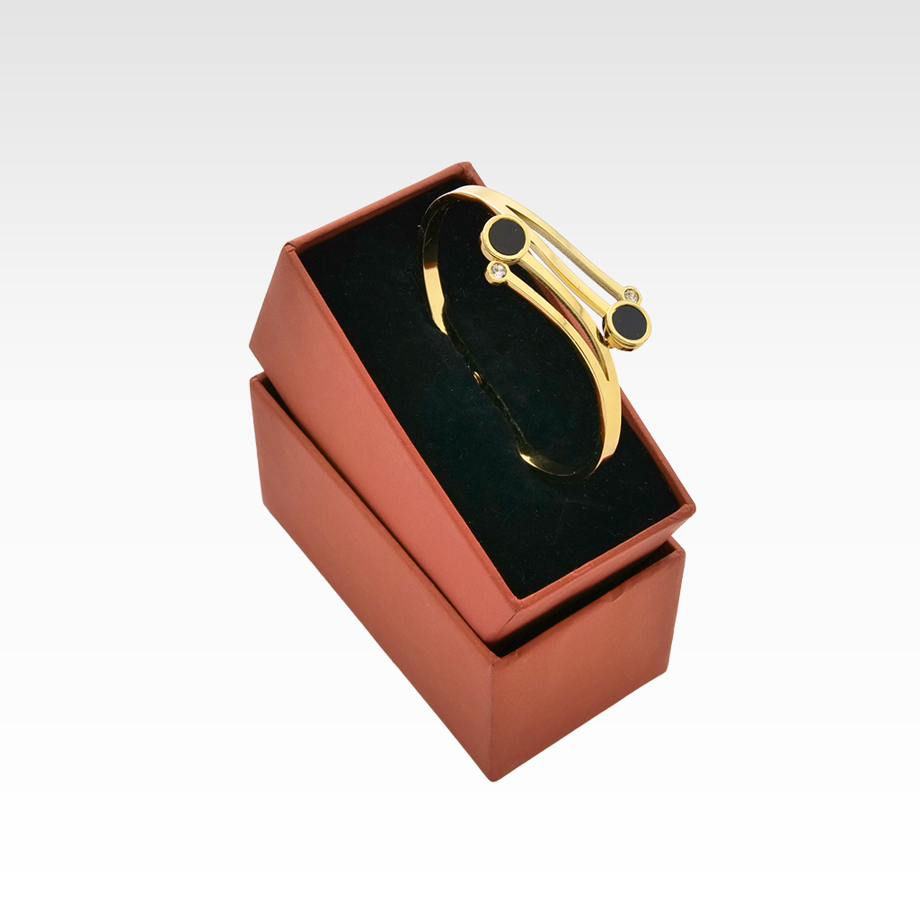 The Onyx Orbit Gold Bypass Bangle